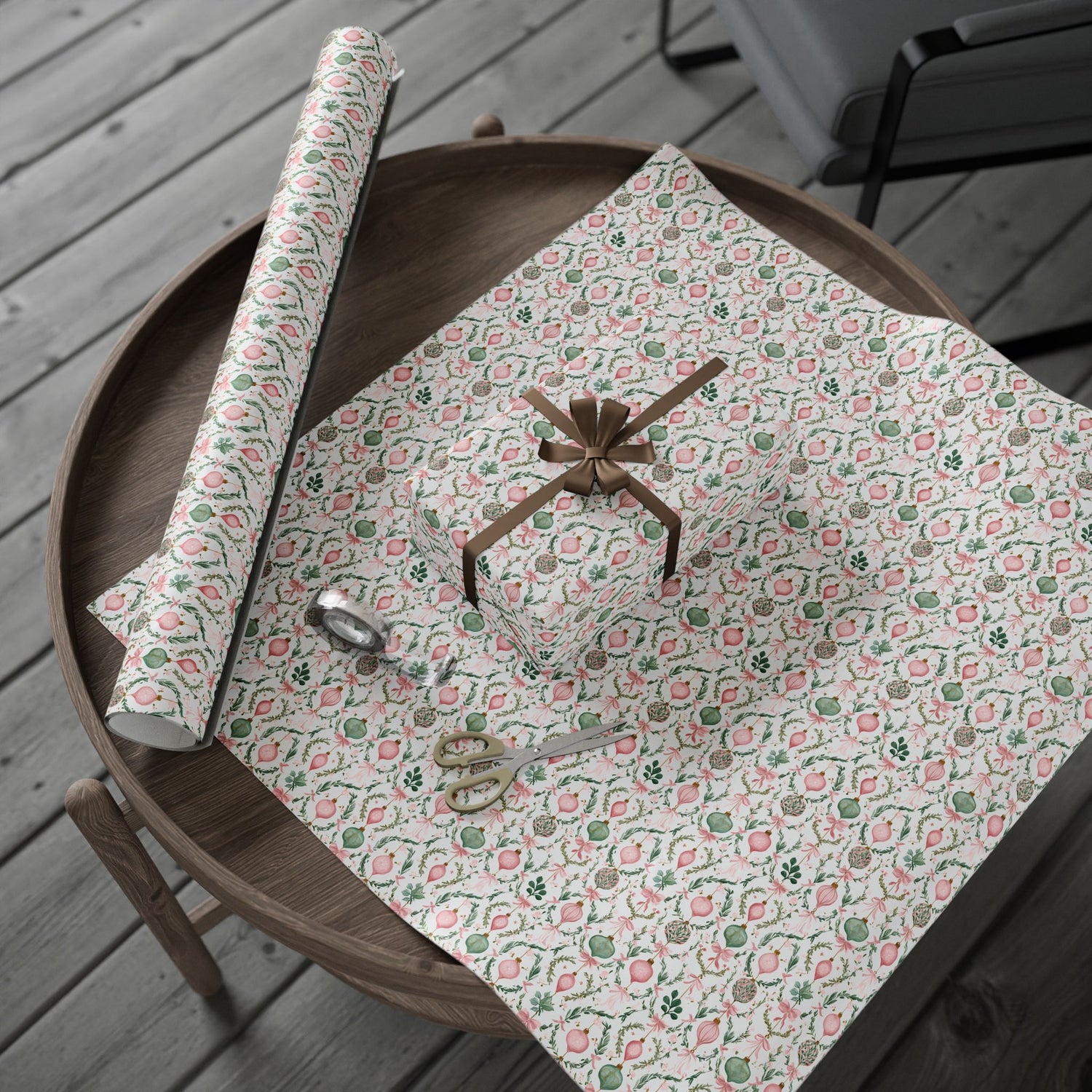 Floral-patterned paper on a wooden table with scissors