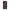 A black phone case with a Christmas tartan plaid pattern.