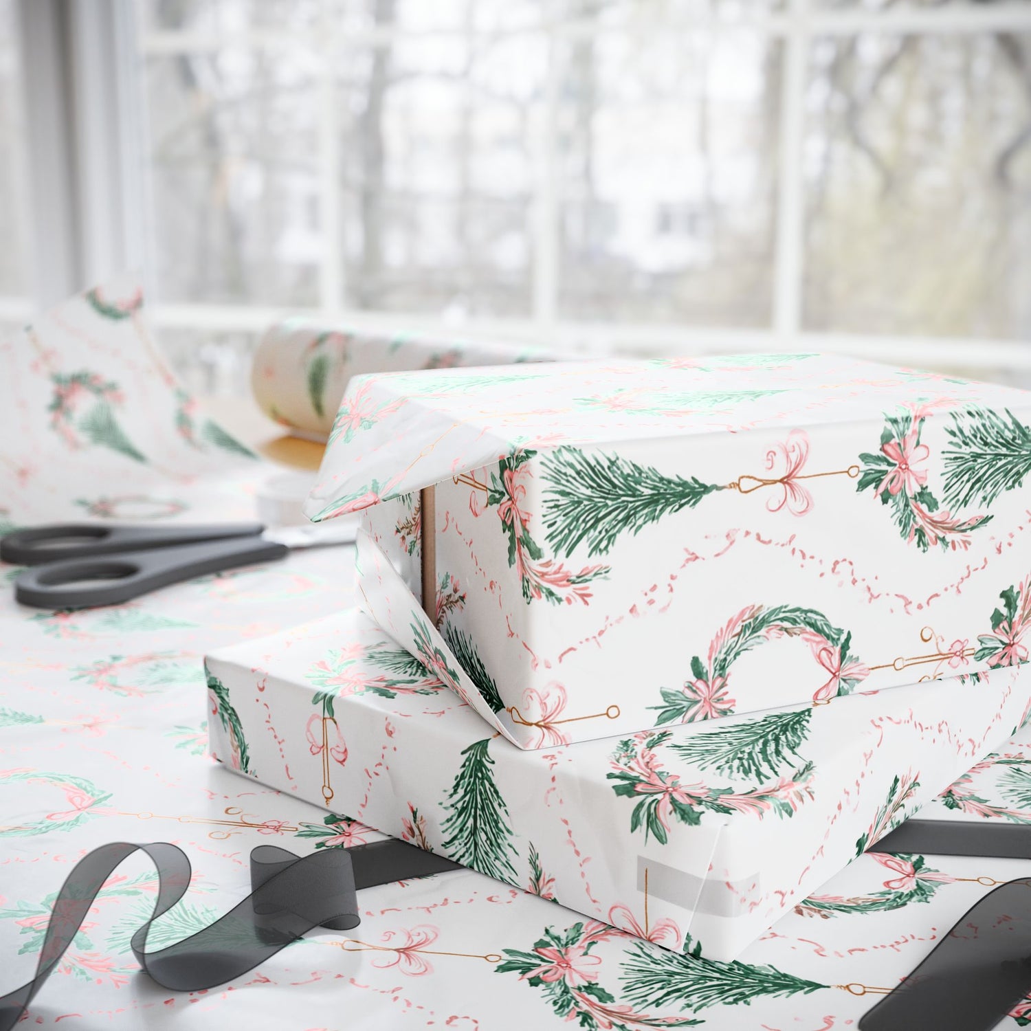 Stack of gift boxes with Christmas-themed wrapping paper on a table.