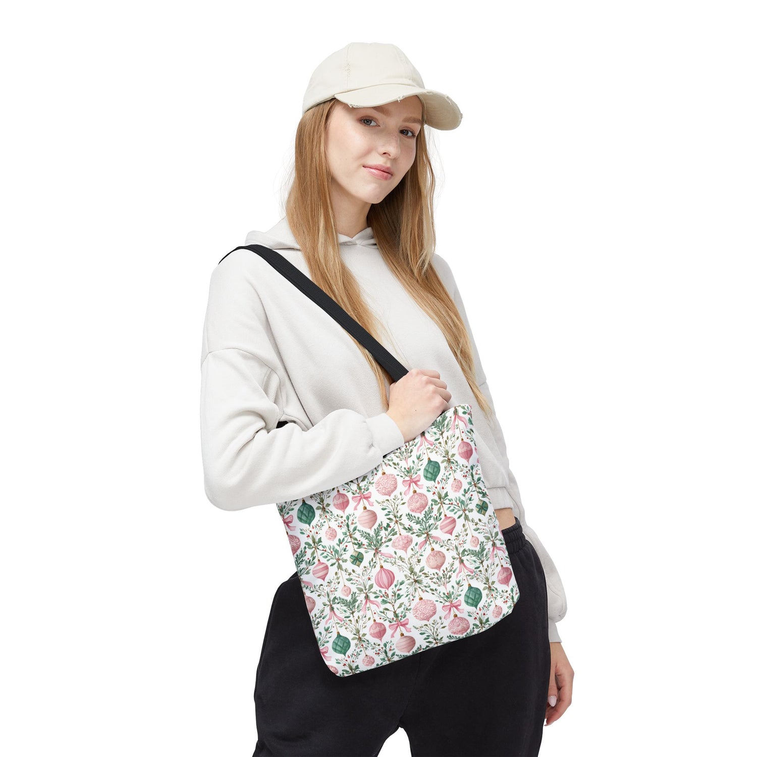 Woman holding a floral-patterned bag on a white background
