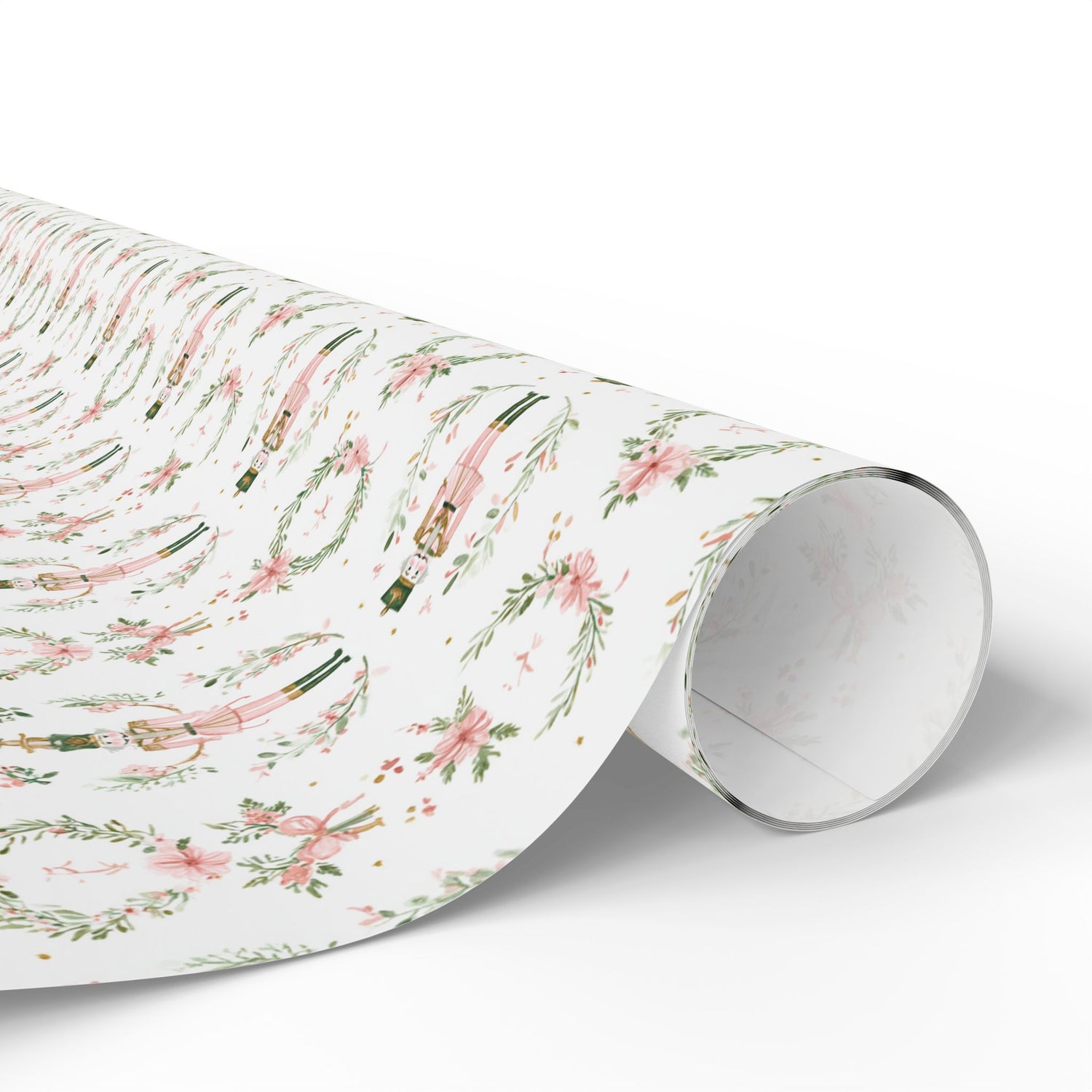 Roll of floral and ribbon patterned paper on a white background