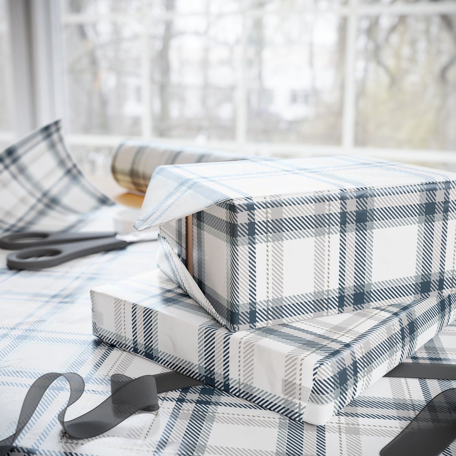Plaid gift wrap with scissors on a table
