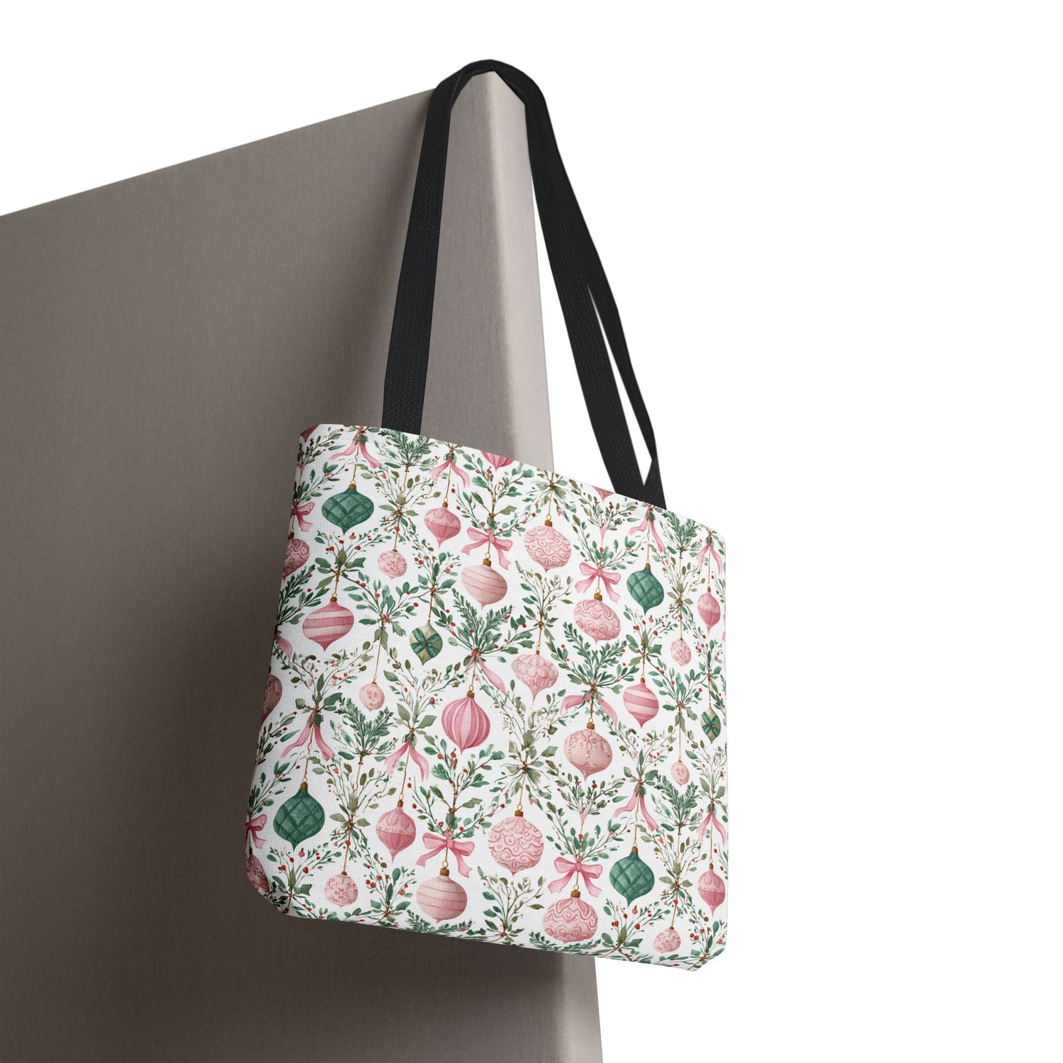 Tote bag with floral and Christmas ornament pattern on a plain background