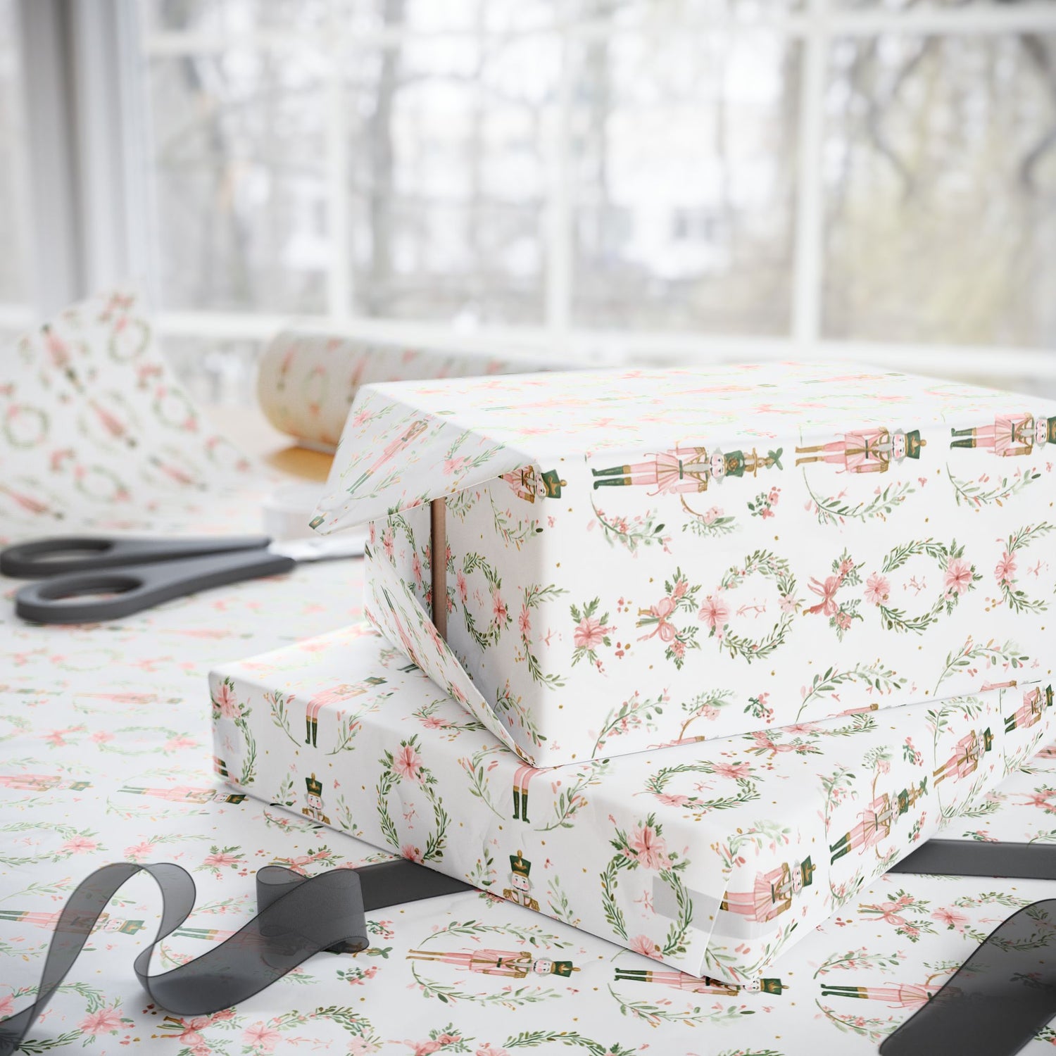 Gift wrap with festive design on a table with scissors