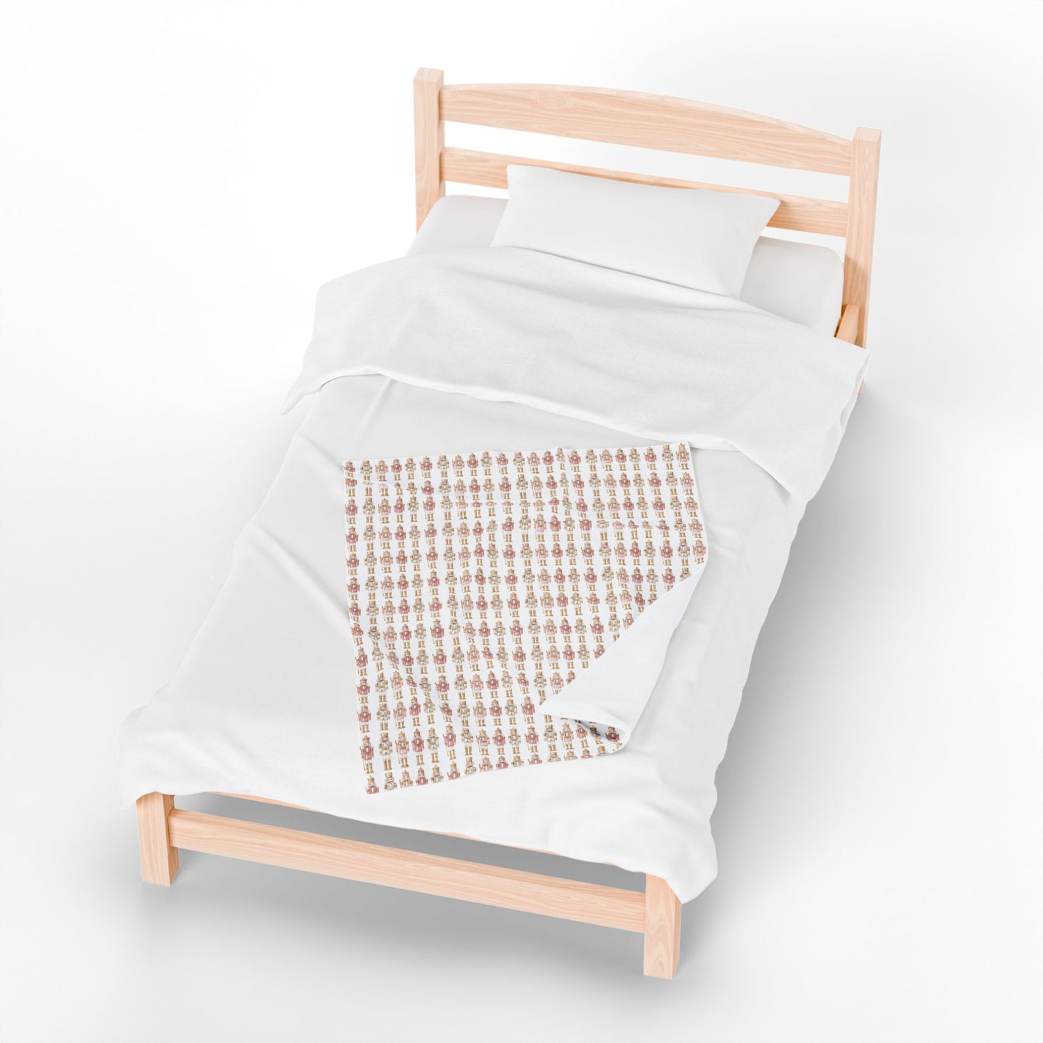 Wooden bed frame with white bedding and a patterned throw blanket on a white background