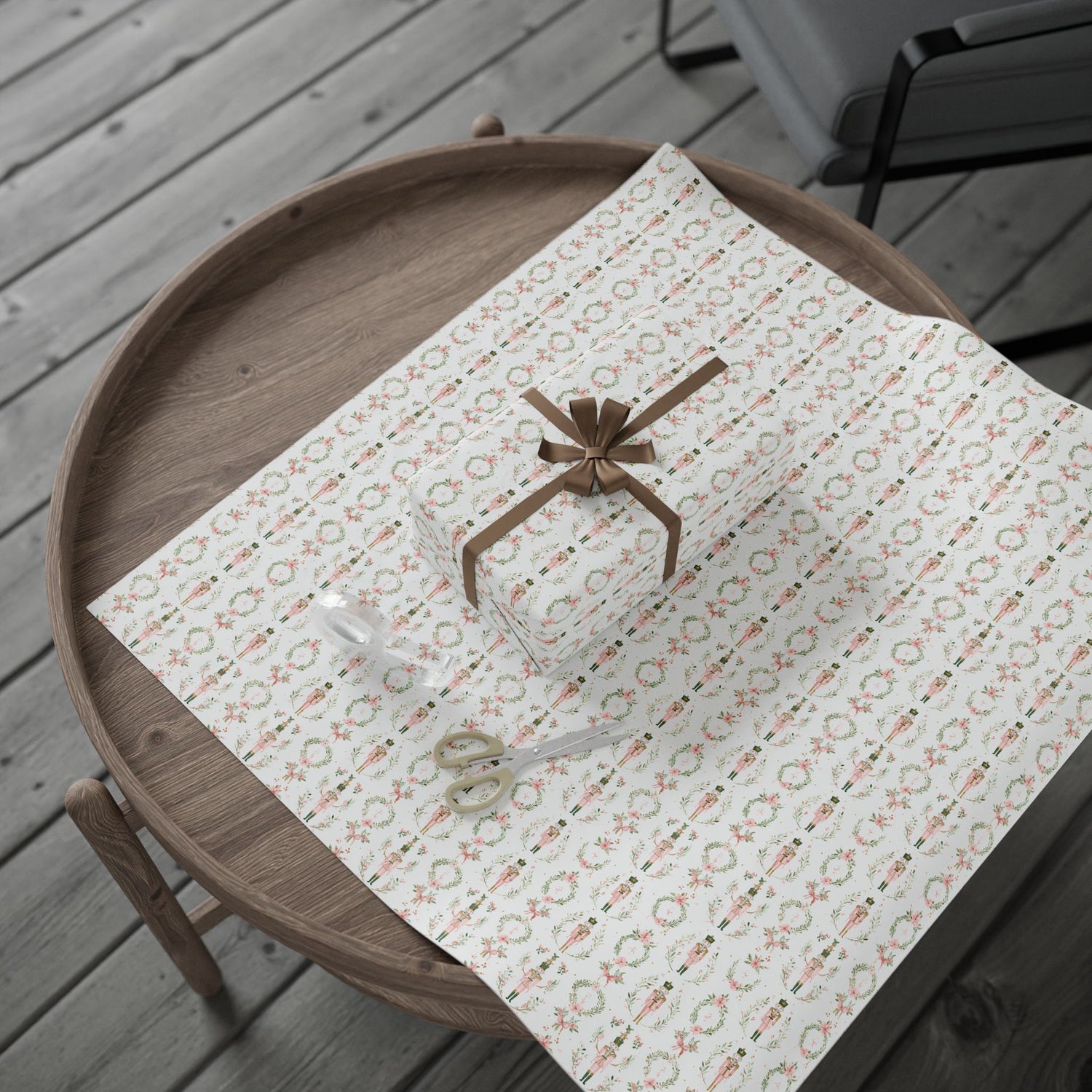 Patterned paper with a bow on a wooden tray outdoors