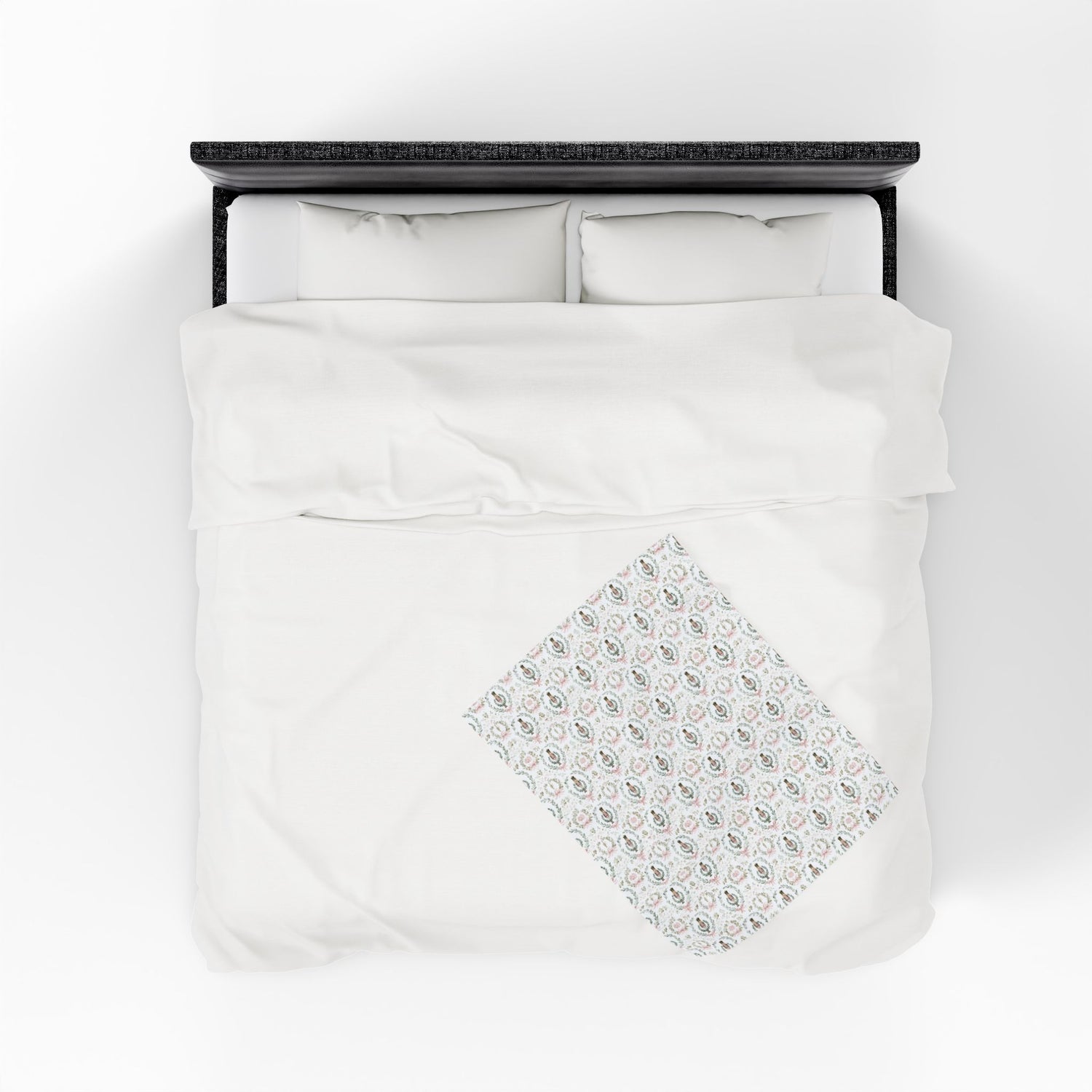 White bedding set with a diamond pattern on a white background
